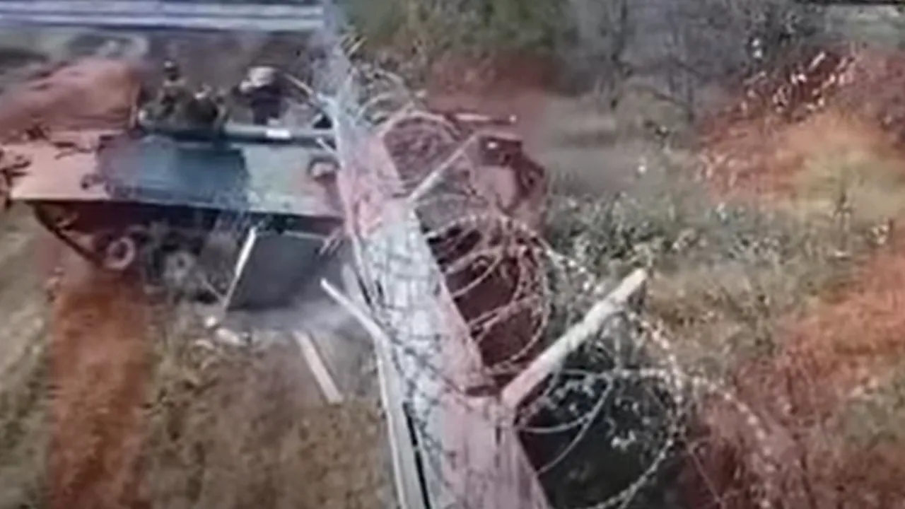 Militari bauti dau cu tancul in gard 6 