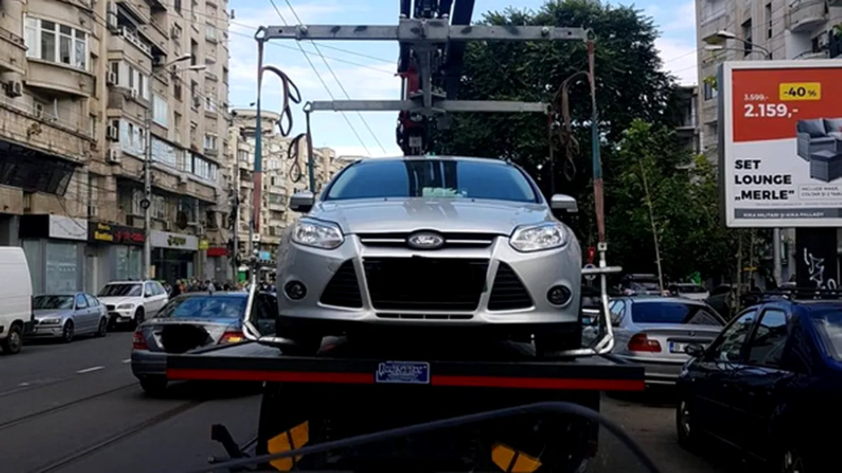 Campania de ridicare a maşinilor staţionate neregulamentar continuă în Bucureşti. Care sunt amenzile 