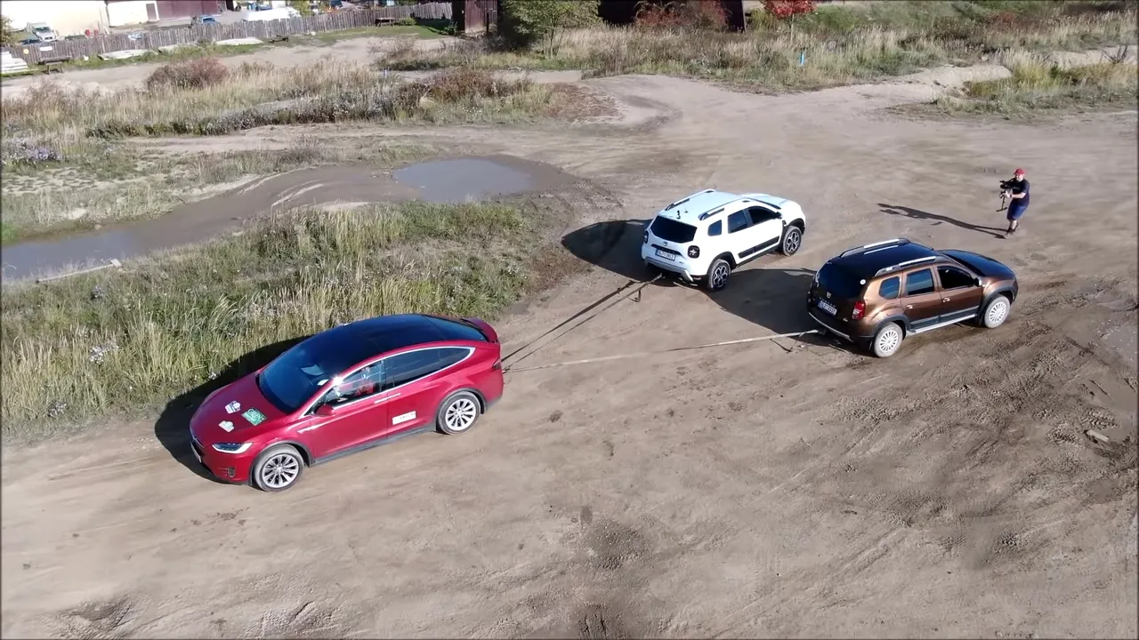 duster-vs-tesla-model-x-027 