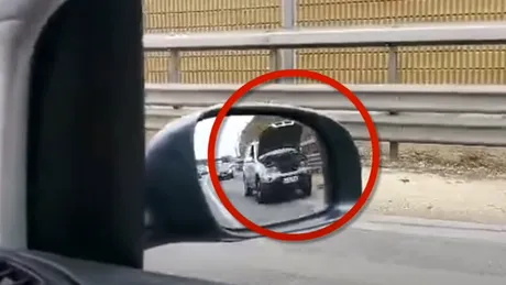 Capota ridicată în mers. Un BMW surprins rulând așa pe autostradă. VIDEO