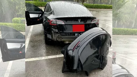 Momentul în care o Tesla Model 3 rămâne fără spoilerul spate la trecerea printr-o baltă